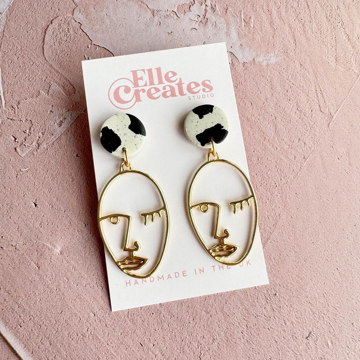 SPECKLED COW PRINT & WINKING FACE STATEMENT EARRINGS
