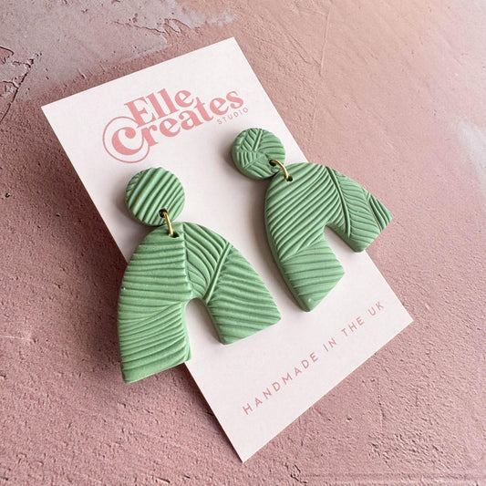 GREEN TEXTURED JUNGLE ARCH STATEMENT EARRINGS