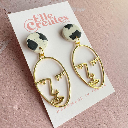 SPECKLED COW PRINT & WINKING FACE STATEMENT EARRINGS