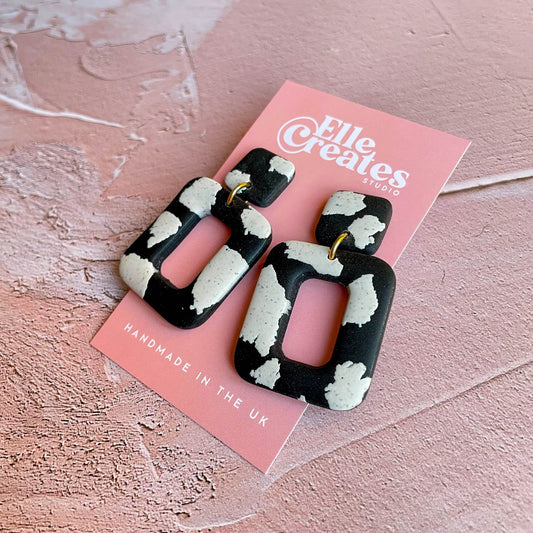 SPECKLED COW PRINT STATEMENT EARRINGS