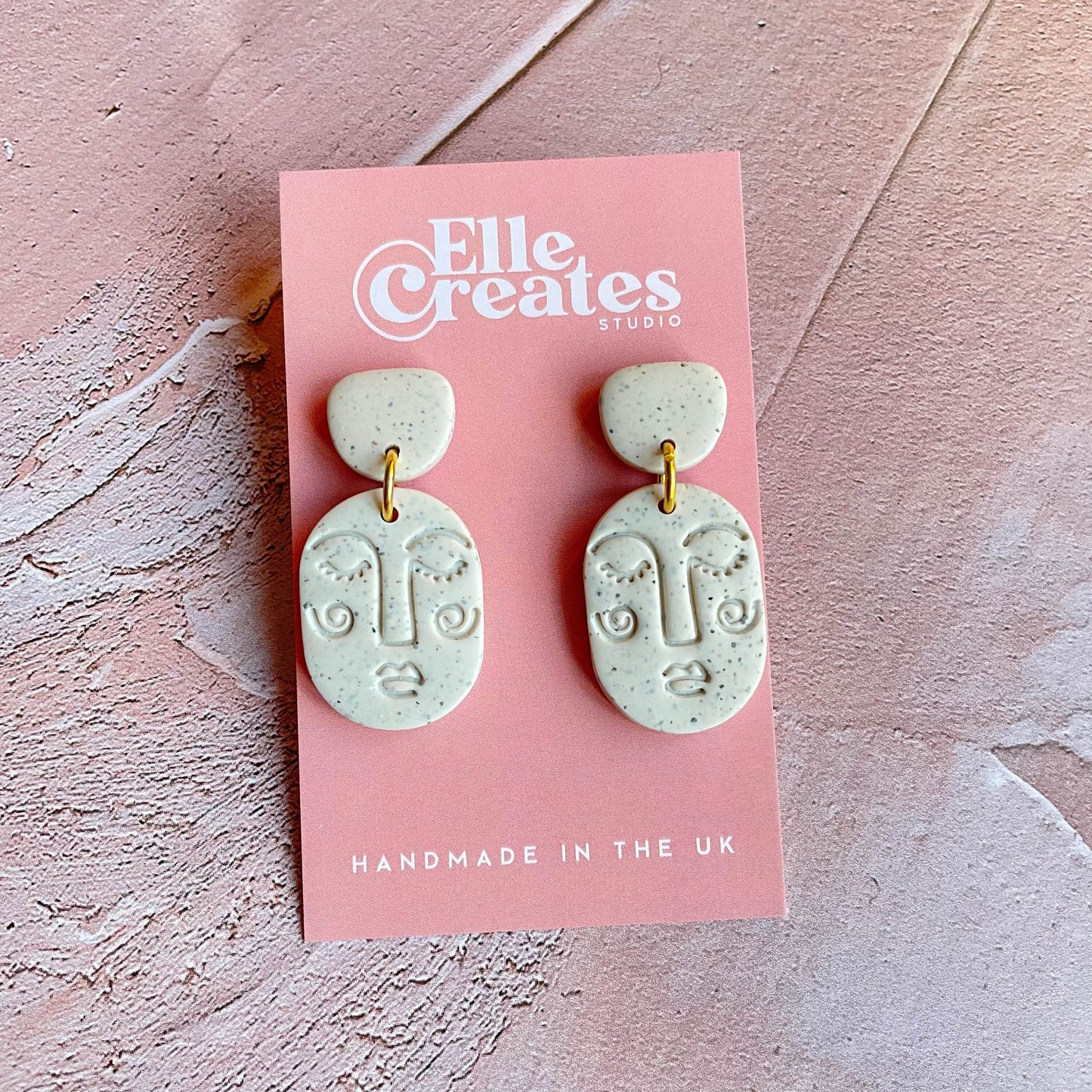 SMALL SPECKLED WHITE BLUSHING FACE STATEMENT EARRINGS