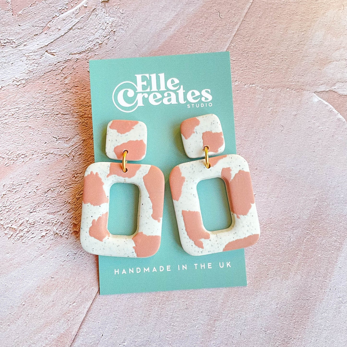 PINK COW PRINT STATEMENT EARRINGS