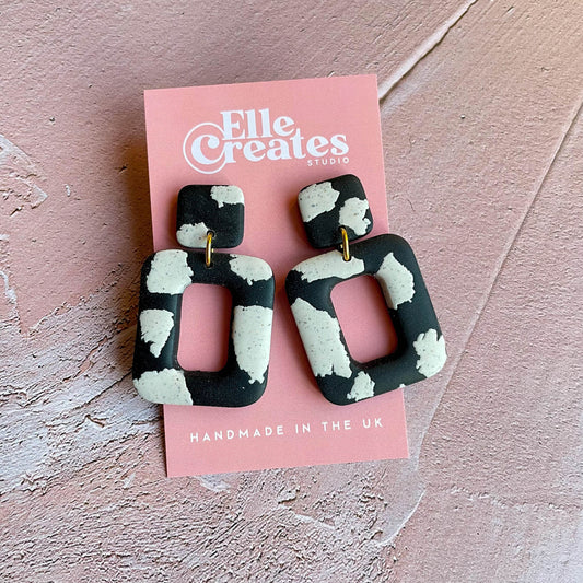 SPECKLED COW PRINT STATEMENT EARRINGS