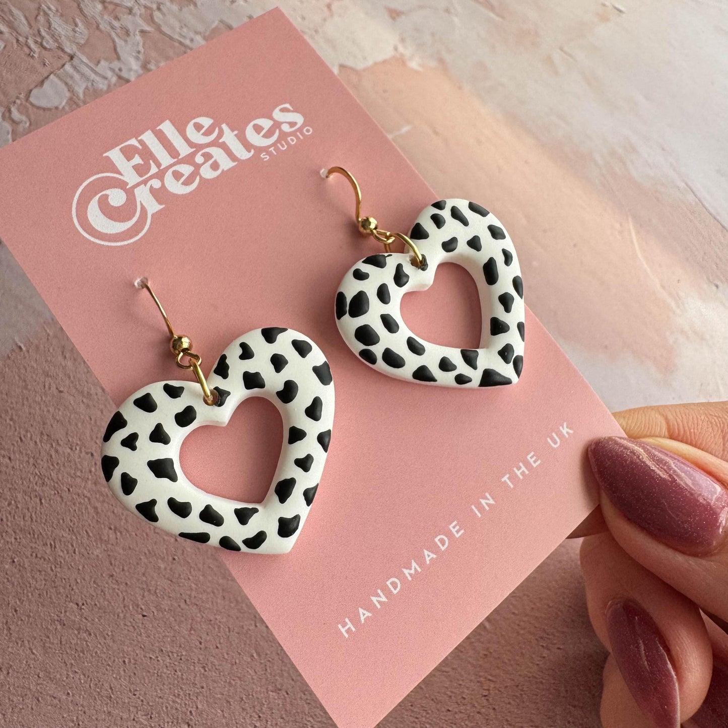 DALMATIAN PRINT HEART DONUT STATEMENT EARRINGS